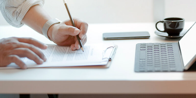 photo-of-person-writing-on-paper-3751619